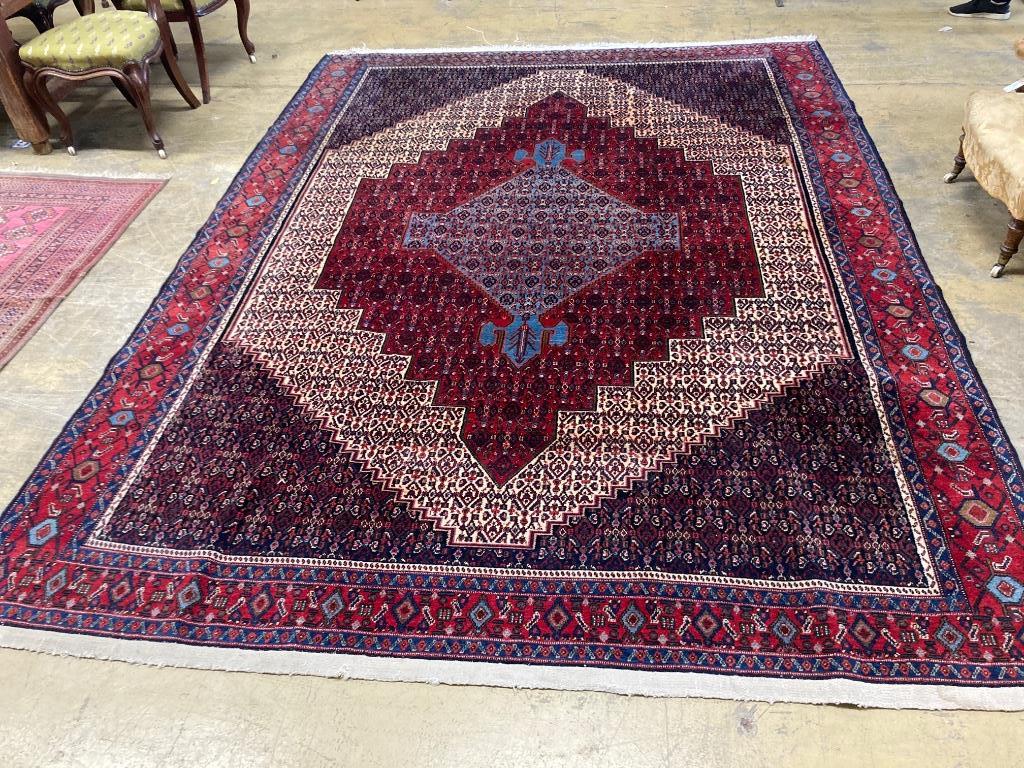 A Feraghan pattern red ground carpet, 320 x 250cm